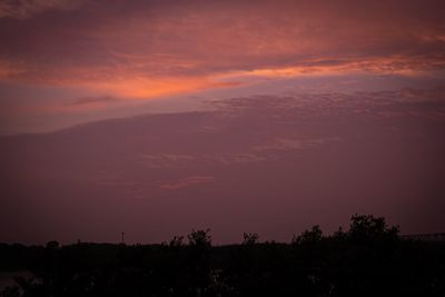 Scenic view of dramatic sky during sunset