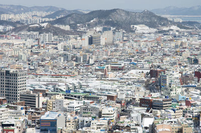 High angle view of buildings in city against sky