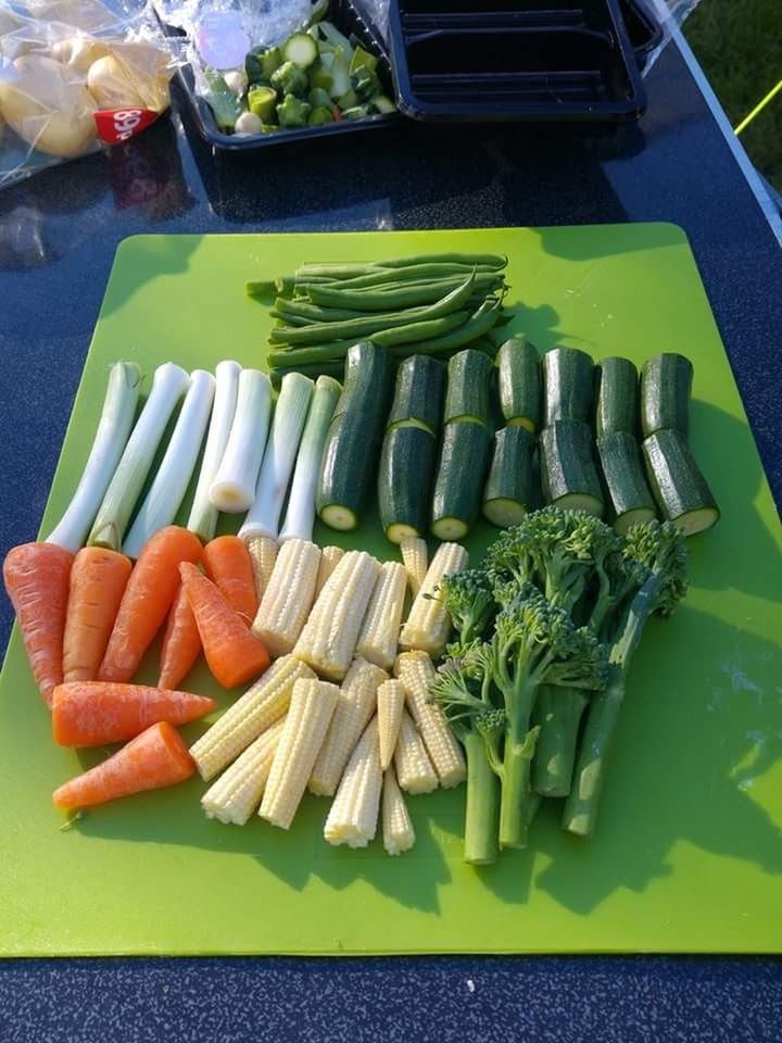 vegetable, food and drink, food, freshness, healthy eating, wellbeing, high angle view, carrot, root vegetable, green color, raw food, still life, no people, large group of objects, variation, table, choice, day, market, indoors, chopped