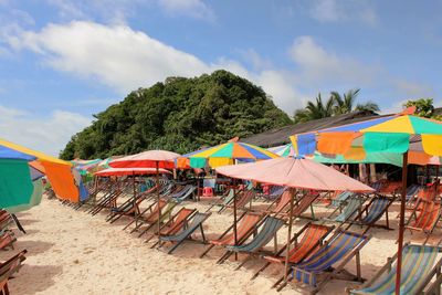 Colorful parasols and folding chairs at beach