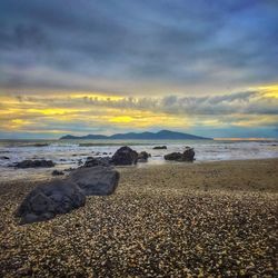 Scenic view of sea against cloudy sky