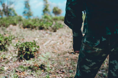 Midsection of man standing against sky