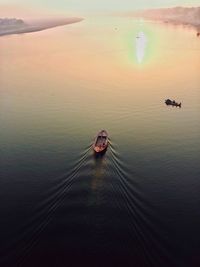 High angle view of sea against sky during sunset