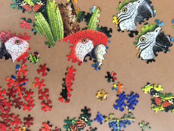 High angle view of multi colored puzzle pieces  on table