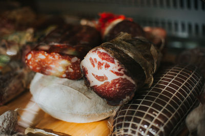 Smoked ham and various meat products on display window