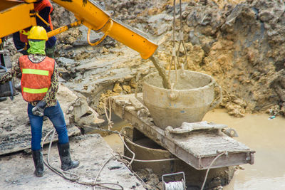 Rear view of man working at construction site