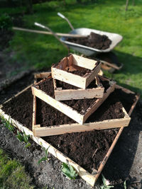 High angle view of stack of wood on field