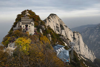 Panoramic view of trees and buildings against sky