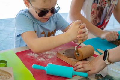 Children make homemade gingerbread cookies