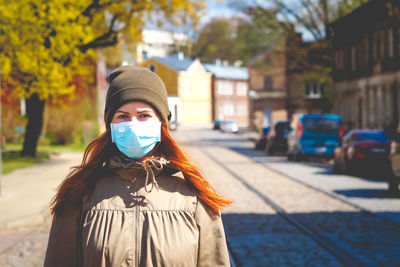 Portrait of woman standing on street
