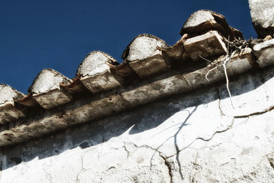 Low angle view of old ruins against clear sky