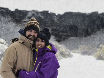 Very happy couple enjoying the snow