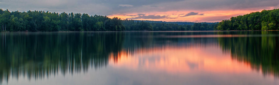 Scenic view of lake against sky during sunset