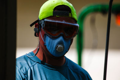 Close-up portrait of man wearing mask