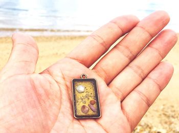 Close-up of person holding key chain