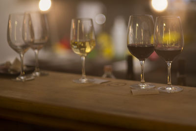 Close-up of wine glasses on table