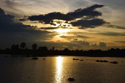 Scenic view of lake against sky during sunset