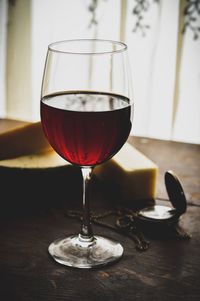 Close-up of wineglass on table