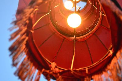 Low angle view of illuminated light bulb