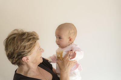 Grandmother playing with her granddaughter