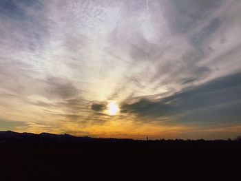 Silhouette landscape against sky during sunset