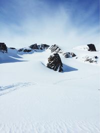 Scenic view of snow covered mountains