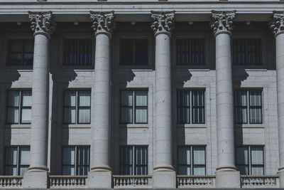 The architecture of buildings windows, stucco molding, and columns on a sunny day in the usa