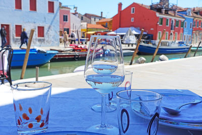 Glasses on tablet at harbor in town