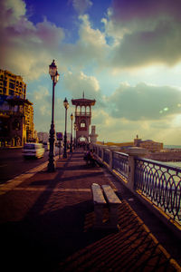 View of street against cloudy sky