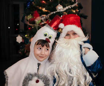 Portrait of woman with christmas tree