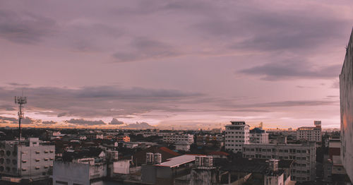 High angle view of buildings against sky at sunset