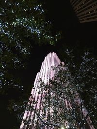 Low angle view of modern building at night