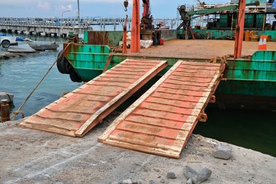 Fishing boats moored at harbor