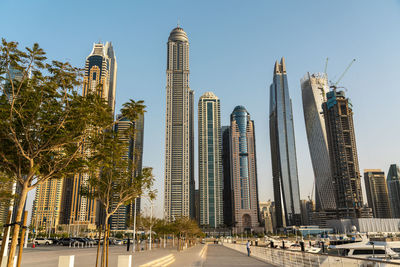 United arab emirates, dubai, dubai marina with tall skyscrapers in background