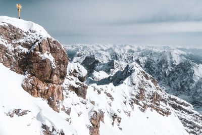 Scenic view of snowcapped mountains against sky