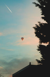 Silhouette of hot air balloon against sky during sunset