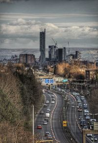 High angle view of city street and buildings against sky