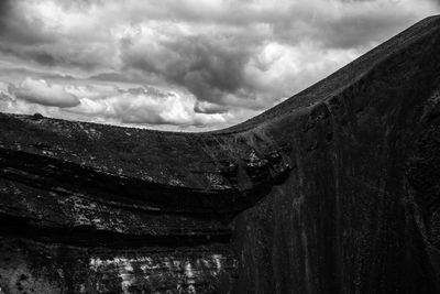 Low angle view of abandoned building against sky