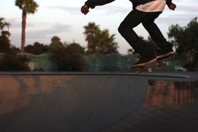 Low section of man skateboarding on skateboard