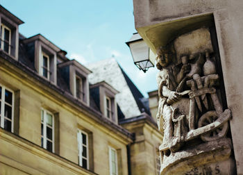 Low angle view of statue against sky