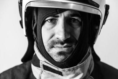 Close-up portrait of man against white background