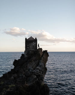 Scenic view of sea against sky at sunset