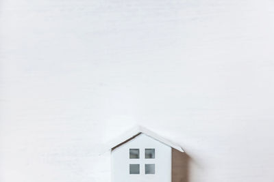 Low angle view of small building in snow