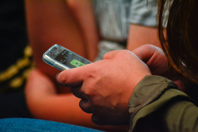 Close-up of woman using mobile phone