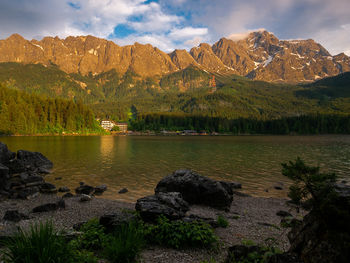 Scenic view of lake and mountains against sky