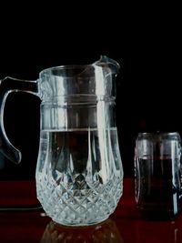 Close-up of wineglass against black background