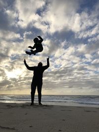 Ocean beach father son