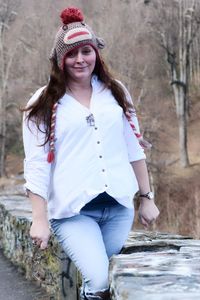 Portrait of young woman wearing hat