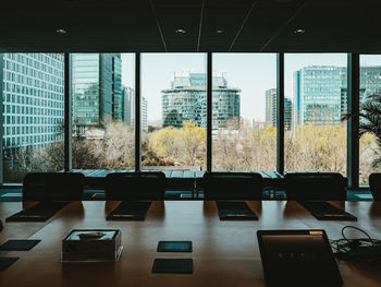 Empty chairs and tables in modern building