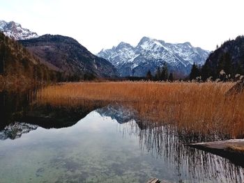 Scenic view of lake and mountains against sky